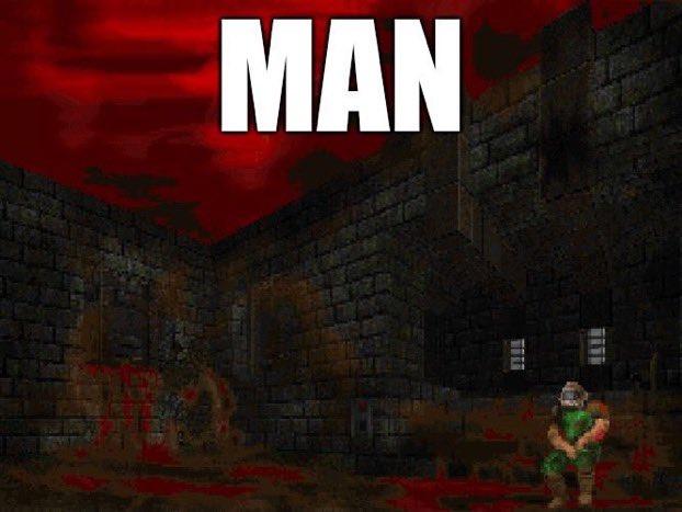 Doomguy sitting, depressed, on some bloodied stairsteps in a brick courtyard under a blood-red sky. A large caption says simply, "MAN"